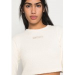 Kobiety T SHIRT TOP | Ellesse PETALO CROPPED - Bluzka z długim rękawem - off white/mleczny - OU70456